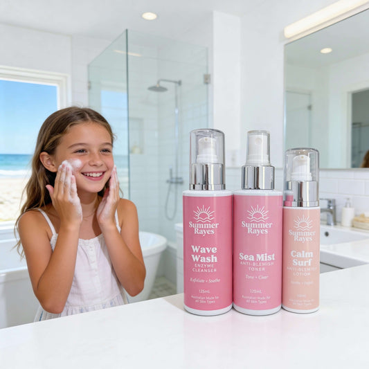 Young girl applying face wash with Summer Rayes skincare products in the foreground.