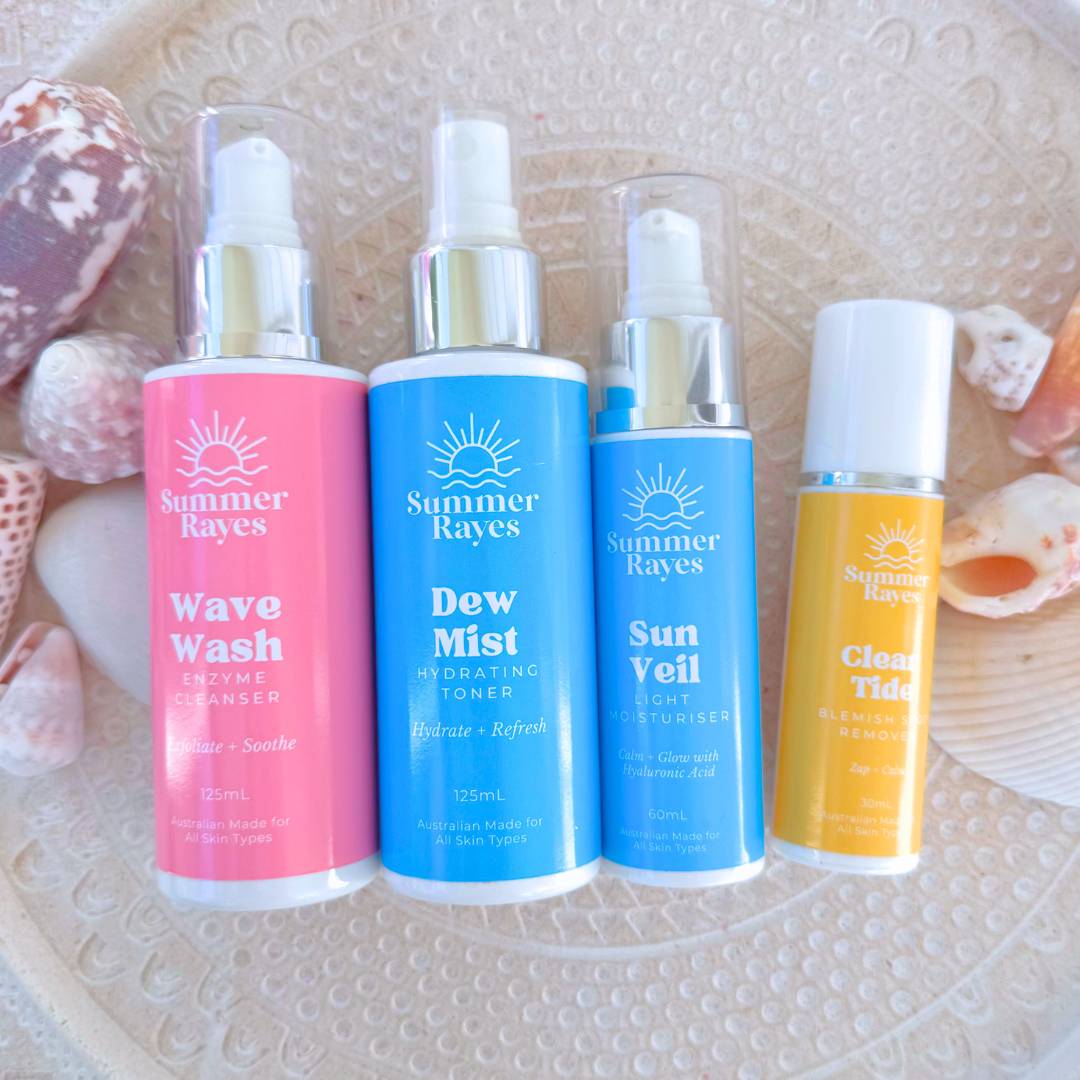 4 Summer Rayes skincare for teens bottles flatlay with shells