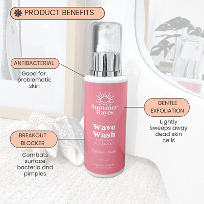 Pink bottle of Summer Rayes Wave Wash Enzyme Cleanser with product benefits text on a white background