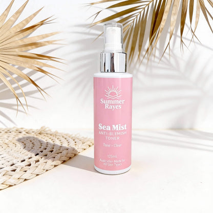 Summer Rayes Sea Mist toner bottle on a light background with palm leaves