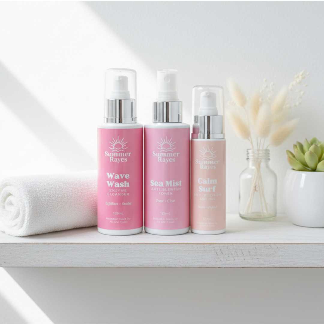 Three pink Summer Rayes teen skincare bottles with silver caps on a white surface with a neutral background
