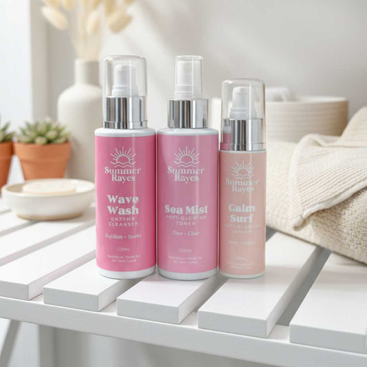 Three pink teen skincare bottles labeled 'Wave Wash', 'Sea Mist', and 'Calm Surf' by Summer Rayes on a white surface.
