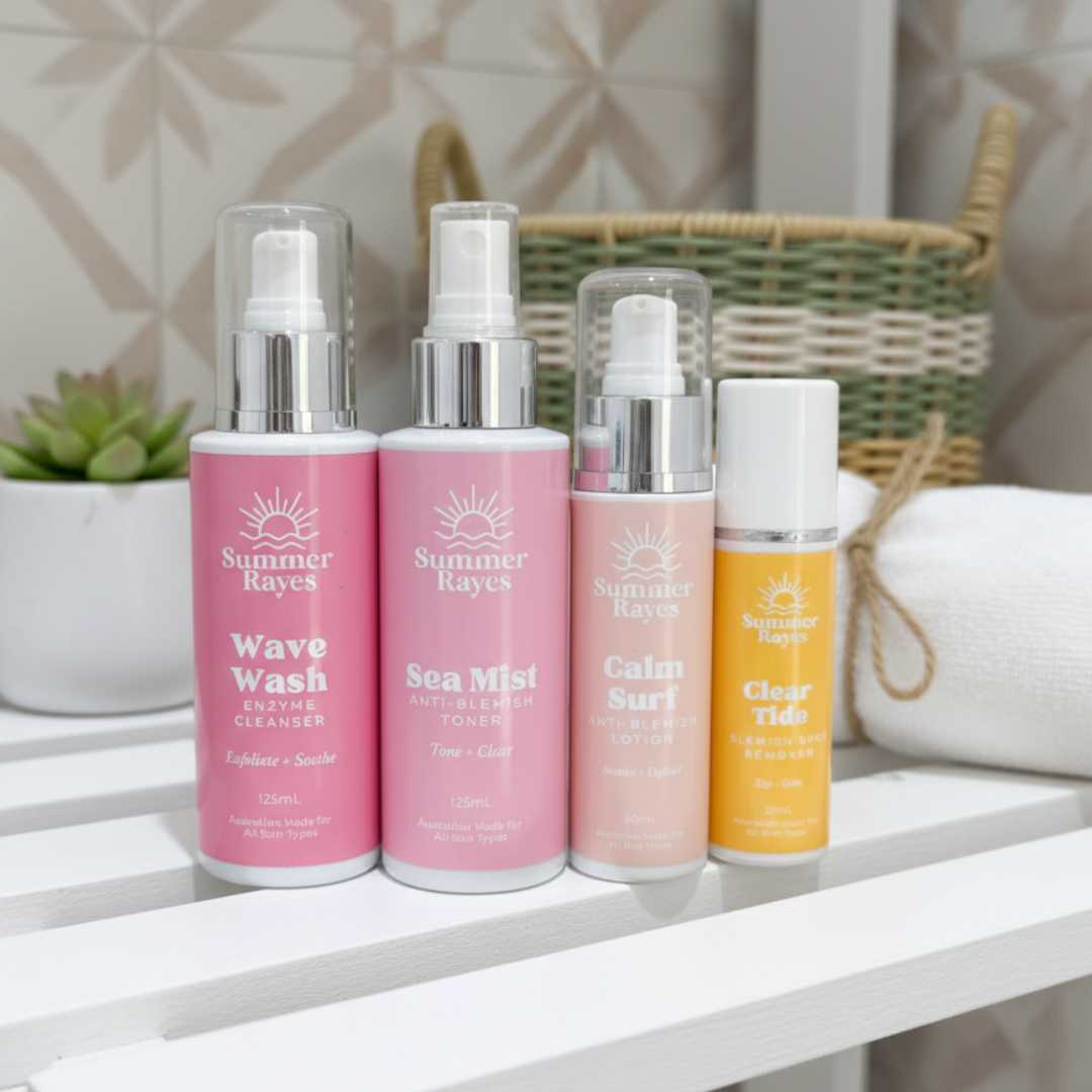 Four Summer Rayes teenage skincare products on a white surface with a blurred background